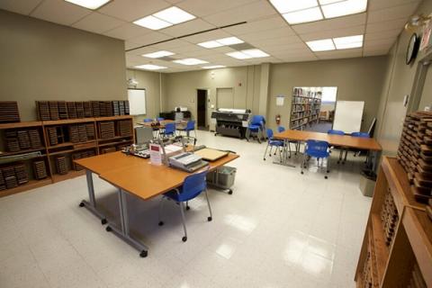 Teacher preparation lab showing tables with equipment and large format printer.